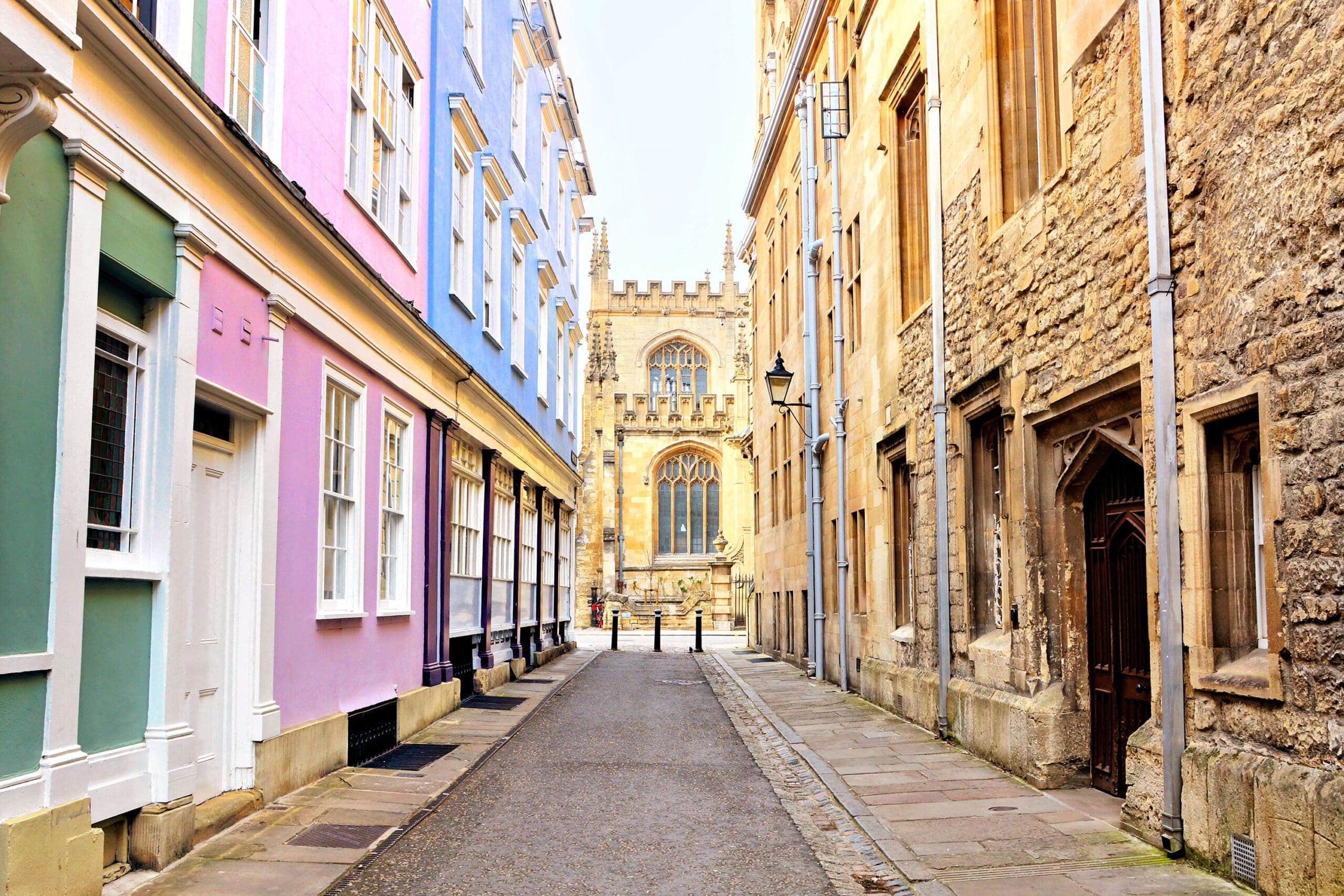 Colorful pastel buildings on a street in the University district of Oxford, home to The Burnside Partnership, specialist private client solicitors in Oxfordshire, Buckinghamshire and London