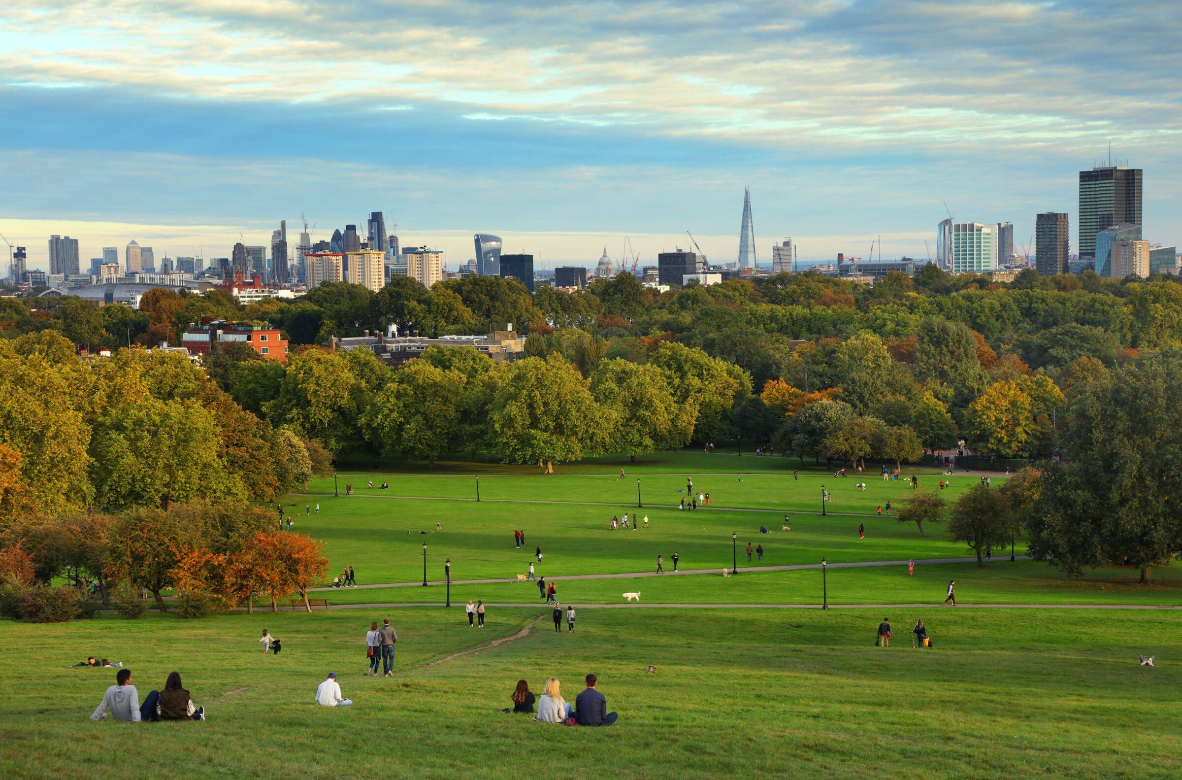 People resting on Primrose Hill at sunset in London. Private Client Law services in London near me.